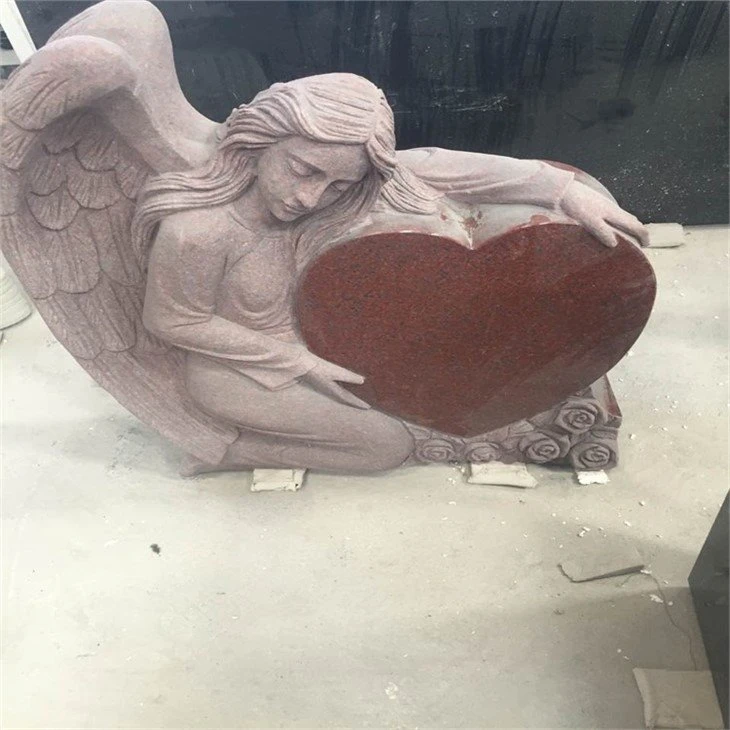 Angel holding heart headstone